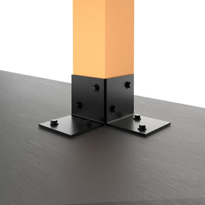 Metal pergola floor bracket securing a vertical wooden post to a flat surface.