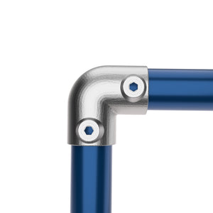 Elbow joint connector pipe fitting connecting two tubes at 90 degree angle.